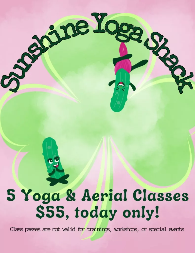 A pink shamrock with two people doing yoga.